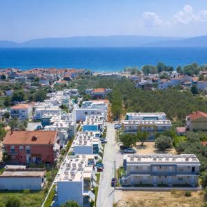 an aerial view of a small town with the ocean at Danai & Palm Stay Complex by Horizon Homes in Ofrínion