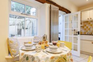 a dining room with a table and a kitchen at 3 Bed in Tideswell oc-w39004 in Tideswell