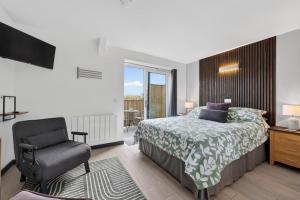 a bedroom with a bed and a chair and a window at 1 Bed in Minsterley oc-s38642 in Minsterley