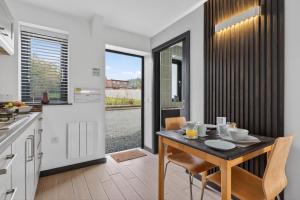 a kitchen and dining room with a table and chairs at 1 Bed in Minsterley oc-s38641 in Minsterley