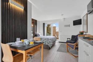 a living room with a table and a bedroom at 1 Bed in Minsterley oc-s38641 in Minsterley