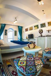 a large bedroom with a bed and a table at Skyrock Dahab in Dahab