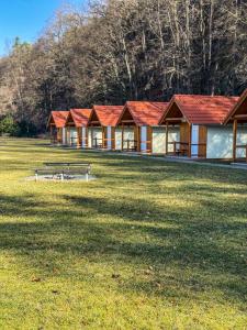 a group of buildings with red roofs in a field at Kemp Koruna in Zlatá Koruna +29 photos