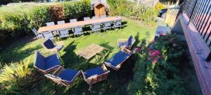an aerial view of a patio with chairs and tables at Île d'Houat - Maison 5ch - 7 à 14 pers. - Piscine & S in La Turballe