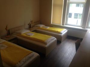 Postel nebo postele na pokoji v ubytování Valdemara Residence