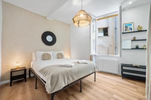 a bedroom with a bed and a window at Sky Lodge - Vieux Nice in Nice