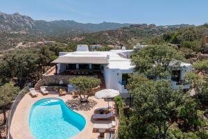 an aerial view of a villa with a swimming pool at Hotel Pitrizza, Costa Smeralda in Porto Cervo