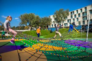 a group of people playing in a nets at Maistra Select Family Hotel Amarin in Rovinj