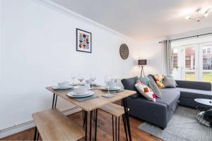 a living room with a couch and a table at Hills Close - 3 Bed House - FREE Parking in Mexborough
