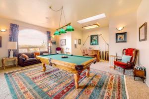 a living room with a pool table at Stunning Spacious Riverfront House with Private Sauna in Florence