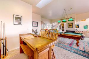 a living room with a pool table and ping pong ball at Stunning Spacious Riverfront House with Private Sauna in Florence