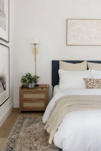 a bedroom with a bed and a table with a plant at Serenity villa homes in Nairobi