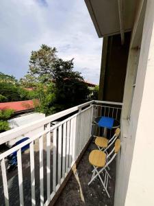 a balcony with two chairs and a table on it at Serenity villa homes in Nairobi