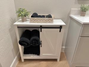 a bathroom with a shelf with towels on it at Serenity villa homes in Nairobi