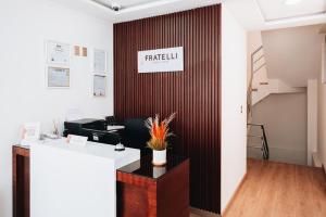 an office with a desk and a wall with a sign that reads fidelity at FRATELLI CORP APART HOTEL in La Paz