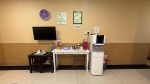 a office with a desk with a computer and a monitor at Jam Hotel Nilai in Nilai +29 photos