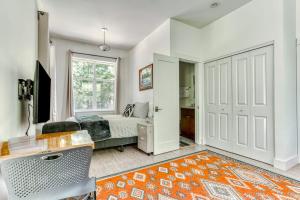 a bedroom with a bed and a desk and a window at Dog-friendly studio with river view patio grill & shared W&D in Stevenson +16 photos