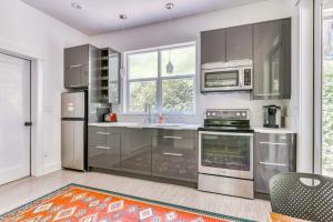 a kitchen with stainless steel appliances and a window at Dog-friendly studio with river view patio grill & shared W&D in Stevenson