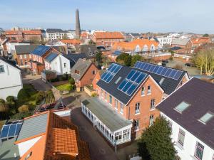 an aerial view of a town with houses with solar panels at Woge2 Appartement 1 in Borkum