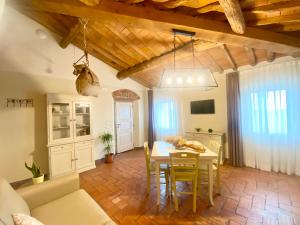 a kitchen and dining room with a table and chairs at Agriturismo Villa Adimari in Cerreto Guidi