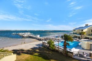 a view of the beach and a dock at Buena Vida 22 - A in Navarre