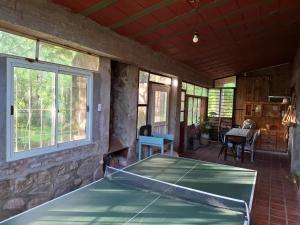 a screened in porch with avertisement for avertisementvertisementosateosateosateosateosate at Casa en El Rodeo in El Rodeo