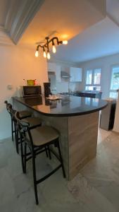 a kitchen with a large island in the middle of a room at SunWave Chott Meriem in Sousse
