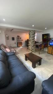 a living room with a couch and a table at SunWave Chott Meriem in Sousse