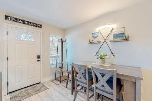 a dining room with a table and chairs and a door at Tranquil condo in Stateline sleeps 4 in Stateline