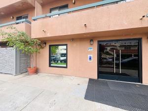 a store front with a large glass door at Steps from UCLA Westwood 1 Bd 1Ba in Los Angeles