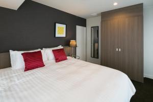 Ένα ή περισσότερα κρεβάτια σε δωμάτιο στο The Ridge Nozawa Apartments