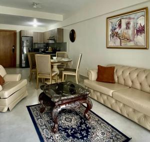 a living room with a couch and a table at Vista Marina Boca Chica in Boca Chica