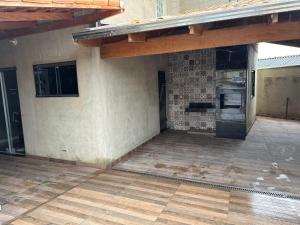 an outdoor patio with a kitchen on a house at Casa Hospedagem e Temporada Mobiliada in Sete Lagoas