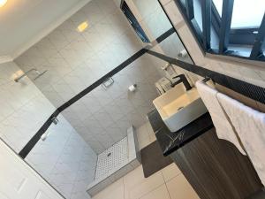 an overhead view of a bathroom with a sink at Florino GuestHouse in Rundu