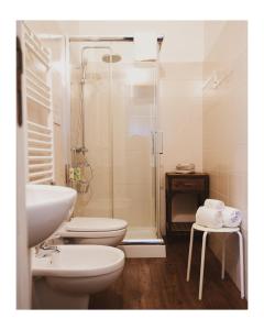 a bathroom with a shower and a toilet and a sink at La Foresteria in Mola di Bari +38 photos
