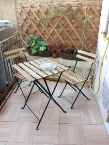 a picnic table and chairs on a patio at Trivia Rent in Reggio di Calabria