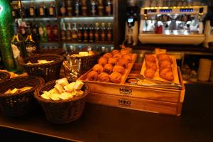 a counter with a bunch of donuts on a table at Hotel Centre Reus in Reus