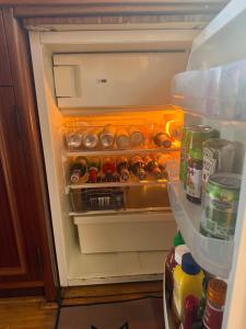 an open refrigerator filled with lots of food and drinks at Salonboot de Wending in Groningen