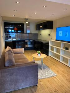 a living room with a couch and a table at Charming view in Olden