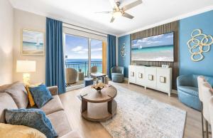 a living room with a couch and a table at Splash Resort Luxury Pools Lazy River Water Parks Sept still Available in Panama City Beach
