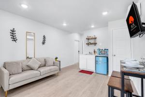 a living room with a couch and a kitchen at The Container Retreat - 7A.. in Canyon Lake +7 photos