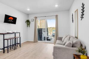 a living room with a couch and a table at The Container Retreat - 7A.. in Canyon Lake