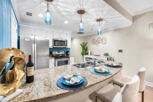 a kitchen with a counter with blue plates on it at Splash Resort Luxury Pools Lazy River Water Parks Sept still Available in Panama City Beach