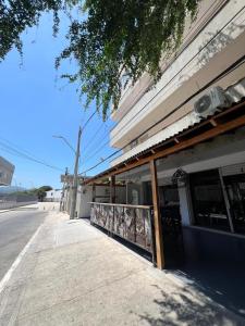 a building on the side of a street at Aparta hotel brisas Del tayrona in Santa Marta