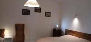 a bedroom with a bed and pictures on the wall at Blu Mare in Punta Marina
