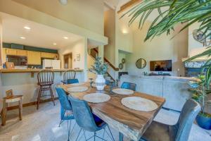 a dining room with a wooden table and blue chairs at Idyllic Incline Village Getaway in Incline Village