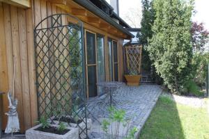 a iron gate on the side of a house at Ferienwohnung Zirbentraum in Breitbrunn am Chiemsee