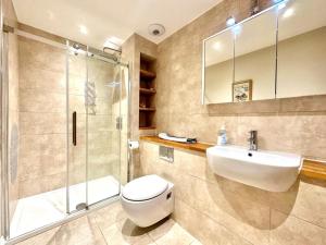 a bathroom with a toilet and a sink and a shower at 2 Bed in Bideford oc-73895 in Westward Ho +13 photos