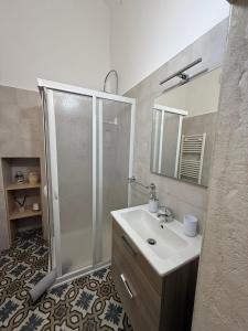 a bathroom with a shower and a sink at Angel House in Locorotondo