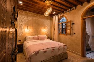 a bedroom with a large bed in a room at Riad Golden in Rabat